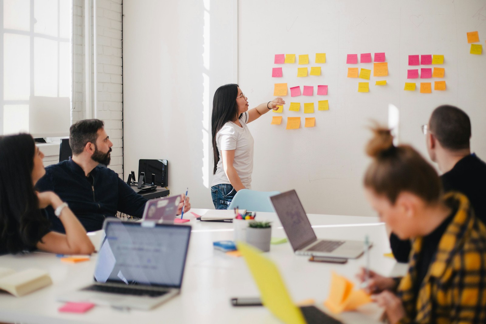 Advisory team discussing long-term wealth planning in a professional office