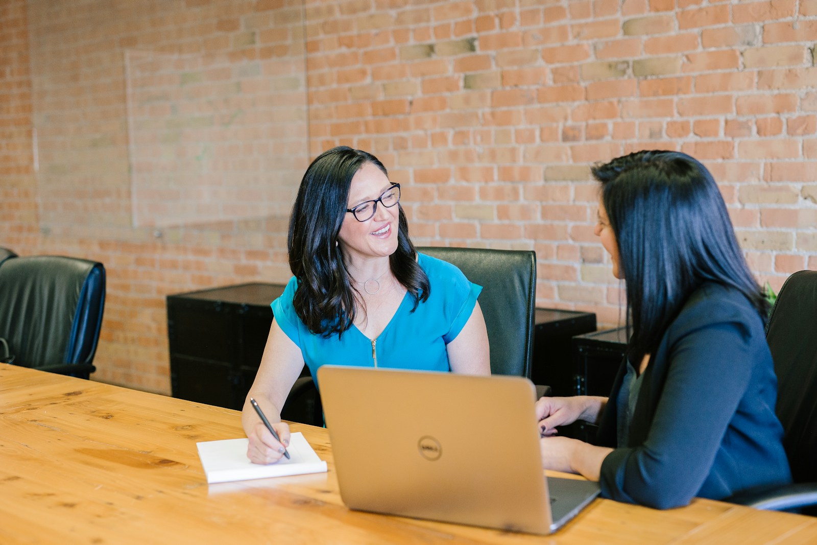 Professional advisors reviewing portfolio materials in a meeting